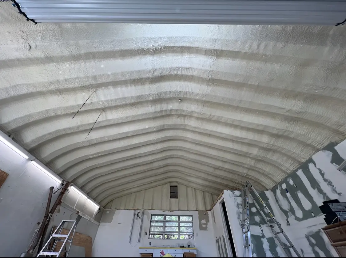 Spray polyurethane foam applied to the underside of a metal roof deck in Grand Rapids